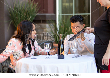 stock-photo-couple-on-a-date-angry-at-a-waitress-in-an-outdoor-restaurant-they-are-upset-and-dissatisfied-1047178639